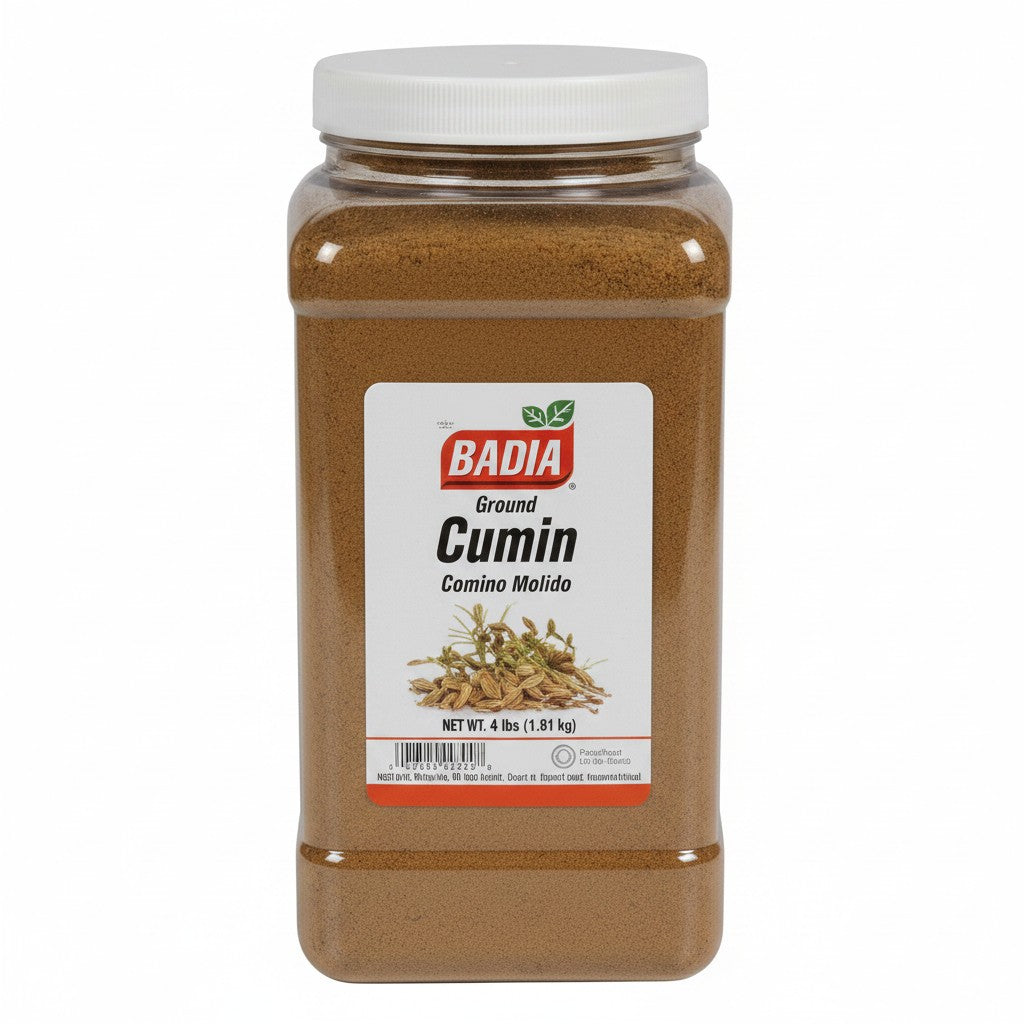 Bodega Badia Ground Cumin spice in a clear 4 lb jug with a white lid. The label shows the Badia logo and "Cumin" in large black letters.