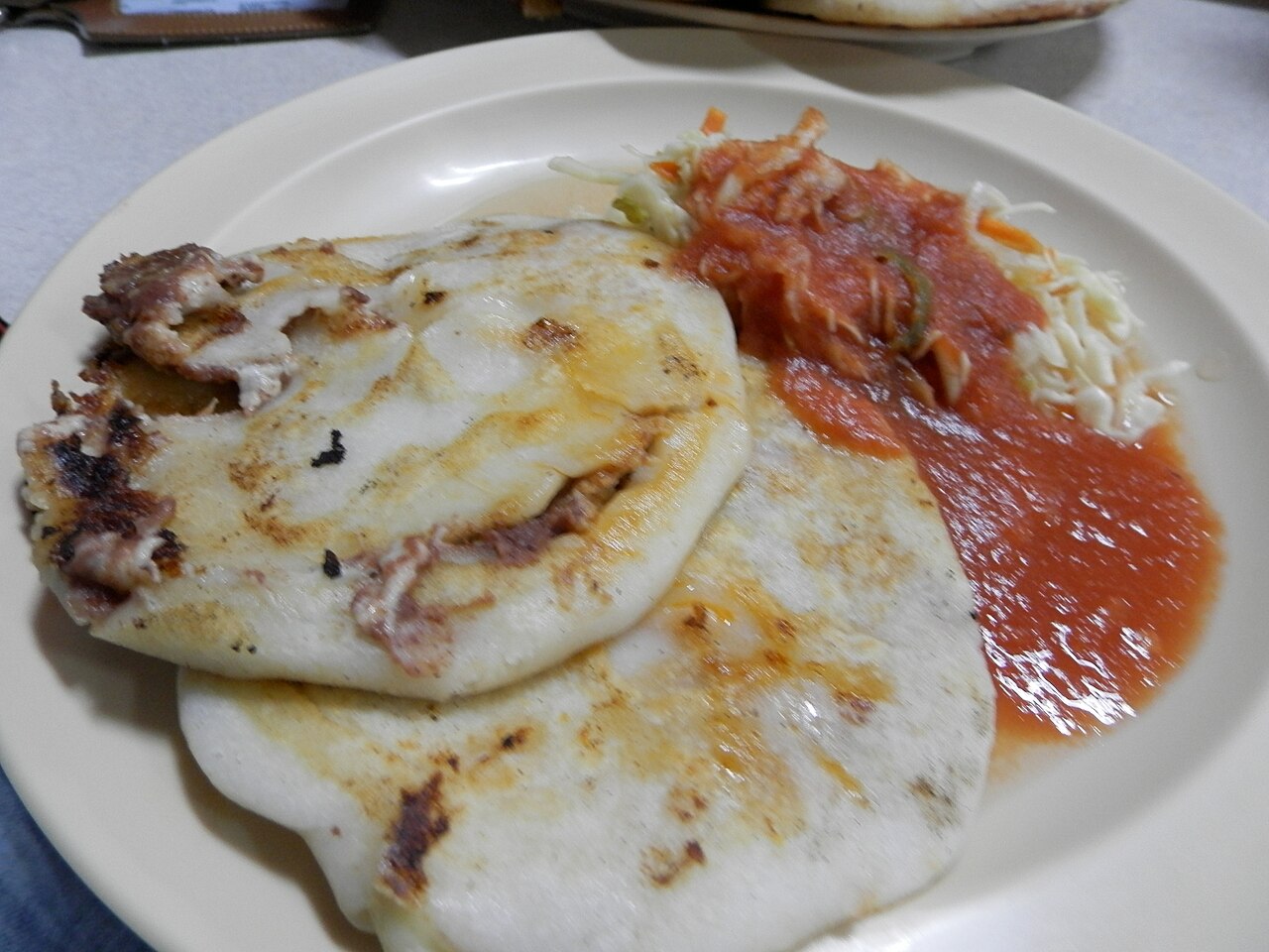 Pupusas with curtido and salsa