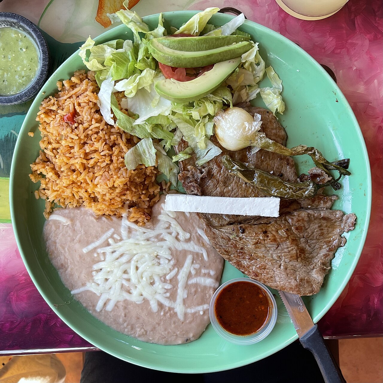 Carne asada with rice and refried beans, a serving variation